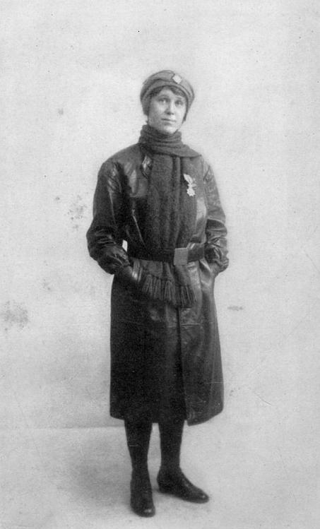 HILDA in her motor-ambulance uniform wearing the "Order of Leopold II,"
conferred on her by King Albert in person.