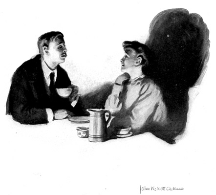 A man and a woman sit at a table.