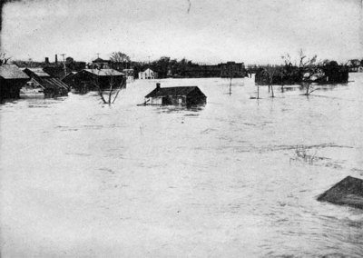 The flood at Watervliet, New York, showing buildings torn from their foundations and floating down the stream. Great damage and untold suffering resulted