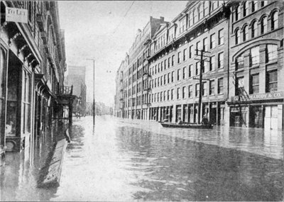 View of River Street In Troy, New York, showing the Collar, Cuff and Shirt Factory of Cluett, Peabody & Company, the largest of its kind in the world, closed on account of the floods. Thousands of people were thrown out of work on account of the overflowing of the Hudson
