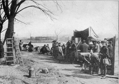 A typical scene at one of the relief stations. Here men, who a few hours before had been millionaires, stood in line with their fellow citizens, quite as much dependent on these relief stations for sustenance as paupers. Orville Wright, the famous aviator, was one of the men in the bread line