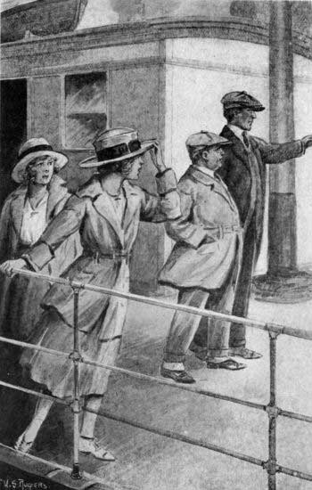 Nan's eyes were following the figures of two men
strolling down the deck. (See page 140)