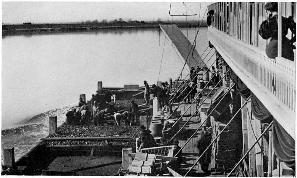 COALING A MOVING BOAT ON THE MISSISSIPPI RIVER.