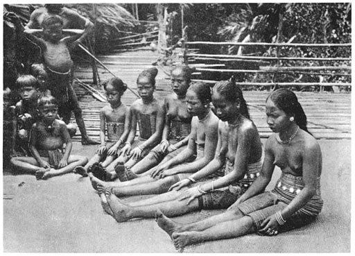 Dayak Women and Children on the Platform outside a long House