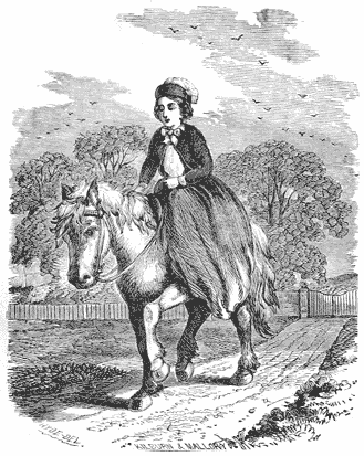 A girl riding sidesaddle on a pony
