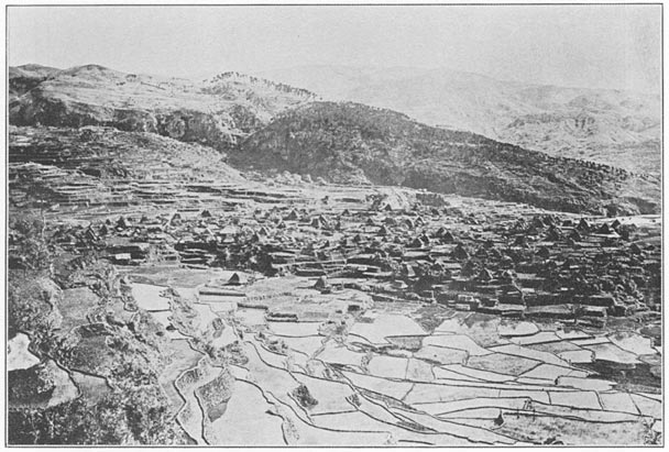Ba-lu′-gan pueblo surrounded by rice sementeras