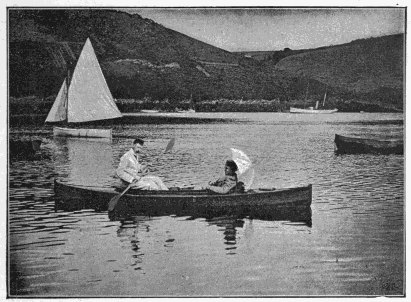 MR. AND MRS. QUILLER COUCH IN A CANADIAN CANOE