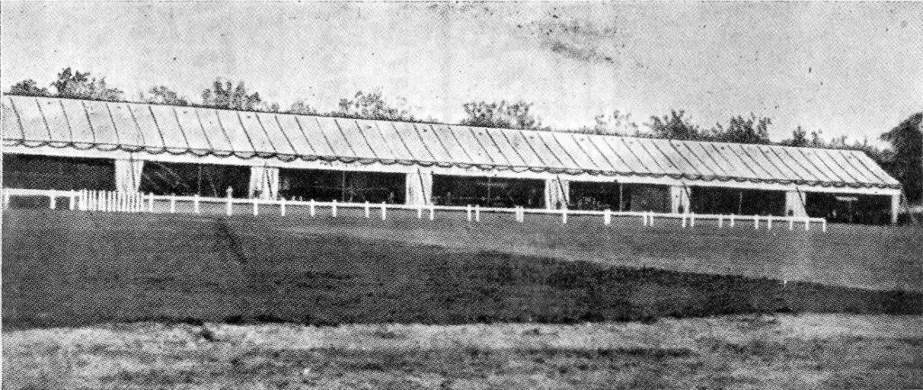 Photo showing row of Canvas Sheds as erected at Brooklands for the Royal Aero Club, July, 1911.