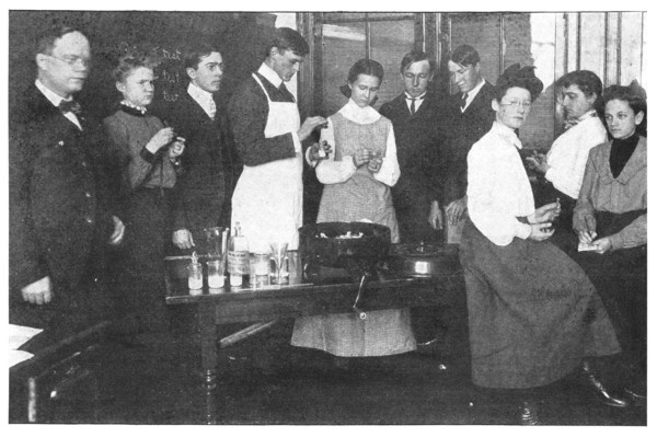 Fig. 6. Using the Babcock milk test at Professor Hollister's School, Corinth, N. Y.