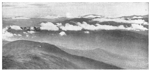 Fig. 14. Clouds clinging to the mountain sides. If one were climbing these mountains he would find himself, in passing through the clouds, either in a fog or a mist.