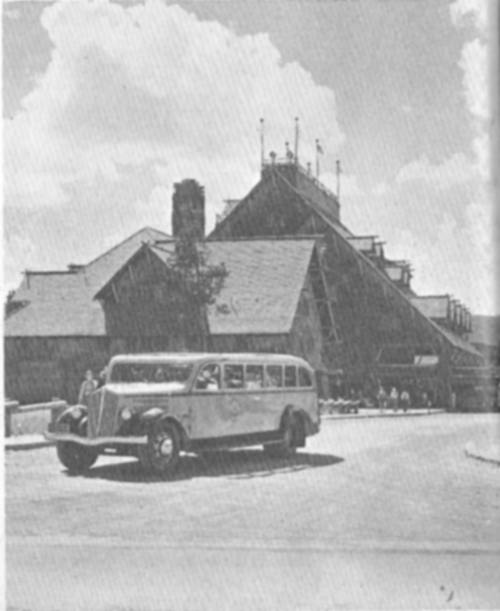 Modern Yellowstone bus leaving Old Faithful Inn