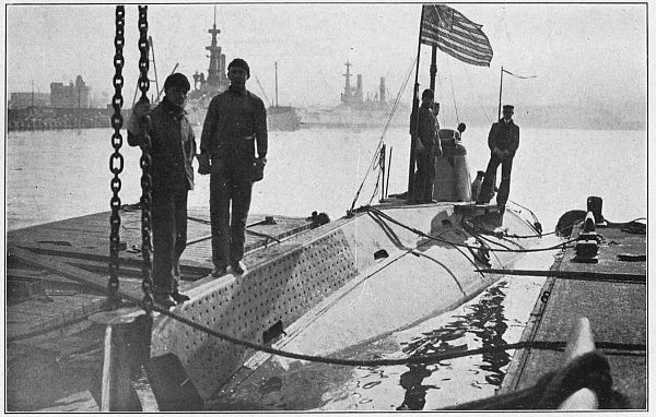 men standing on sub in dock