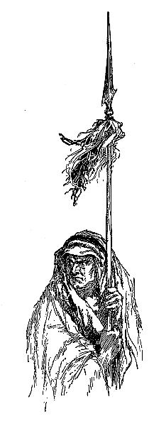 angry looking man holding a long staff